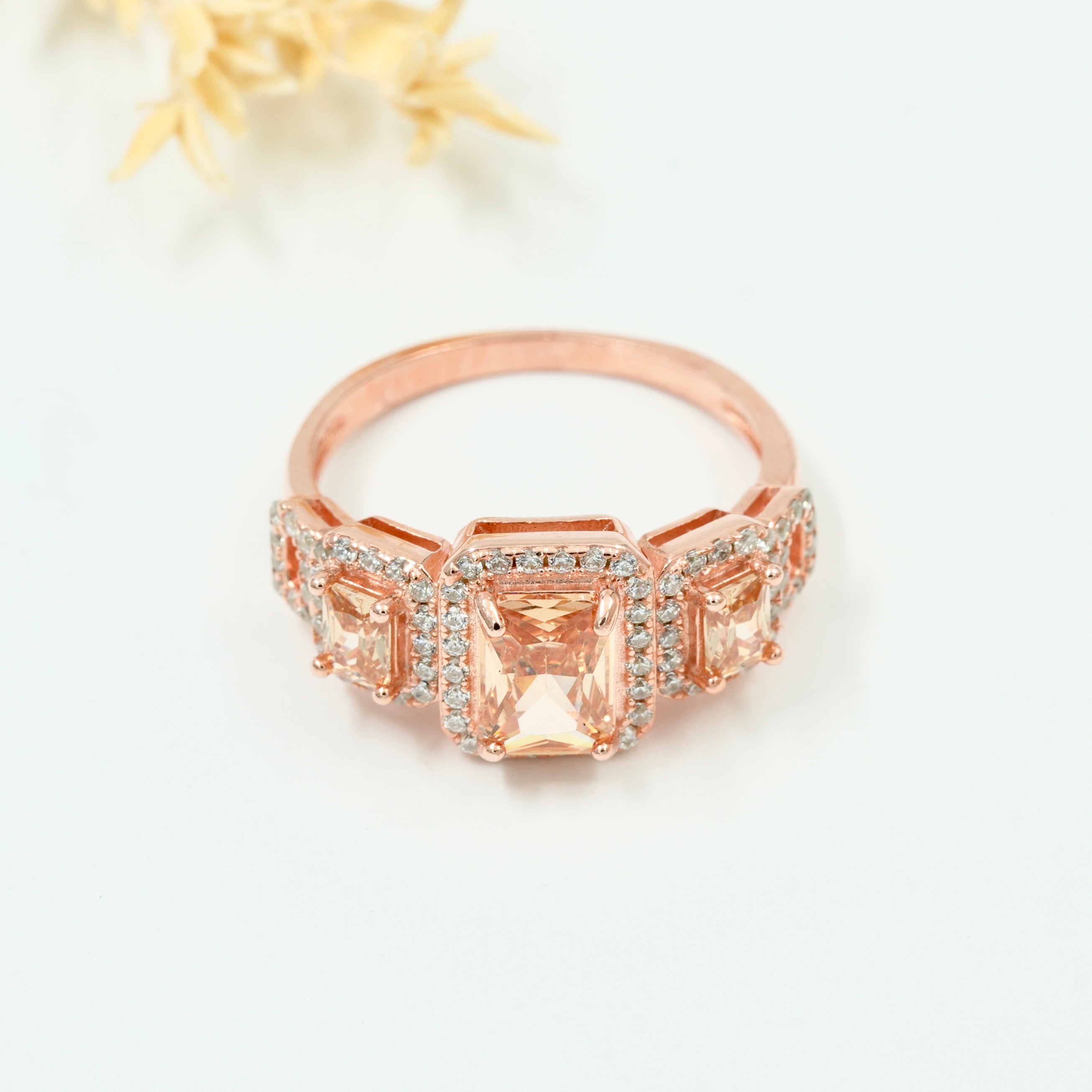 Rose Gold Plated 925 Silver Triple Stone Ring with American Diamond Halo – Available in Blue, Yellow & Peach