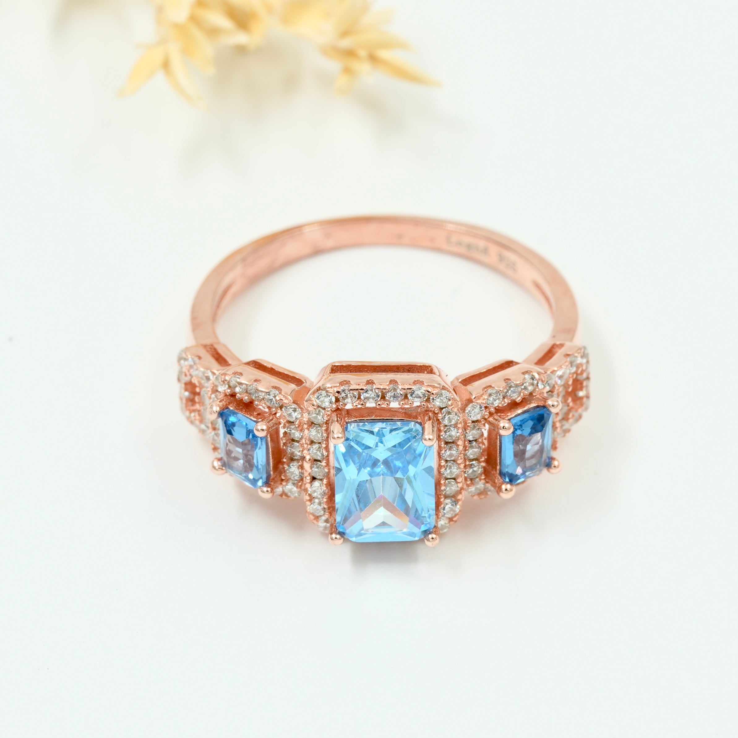 Rose Gold Plated 925 Silver Triple Stone Ring with American Diamond Halo – Available in Blue, Yellow & Peach
