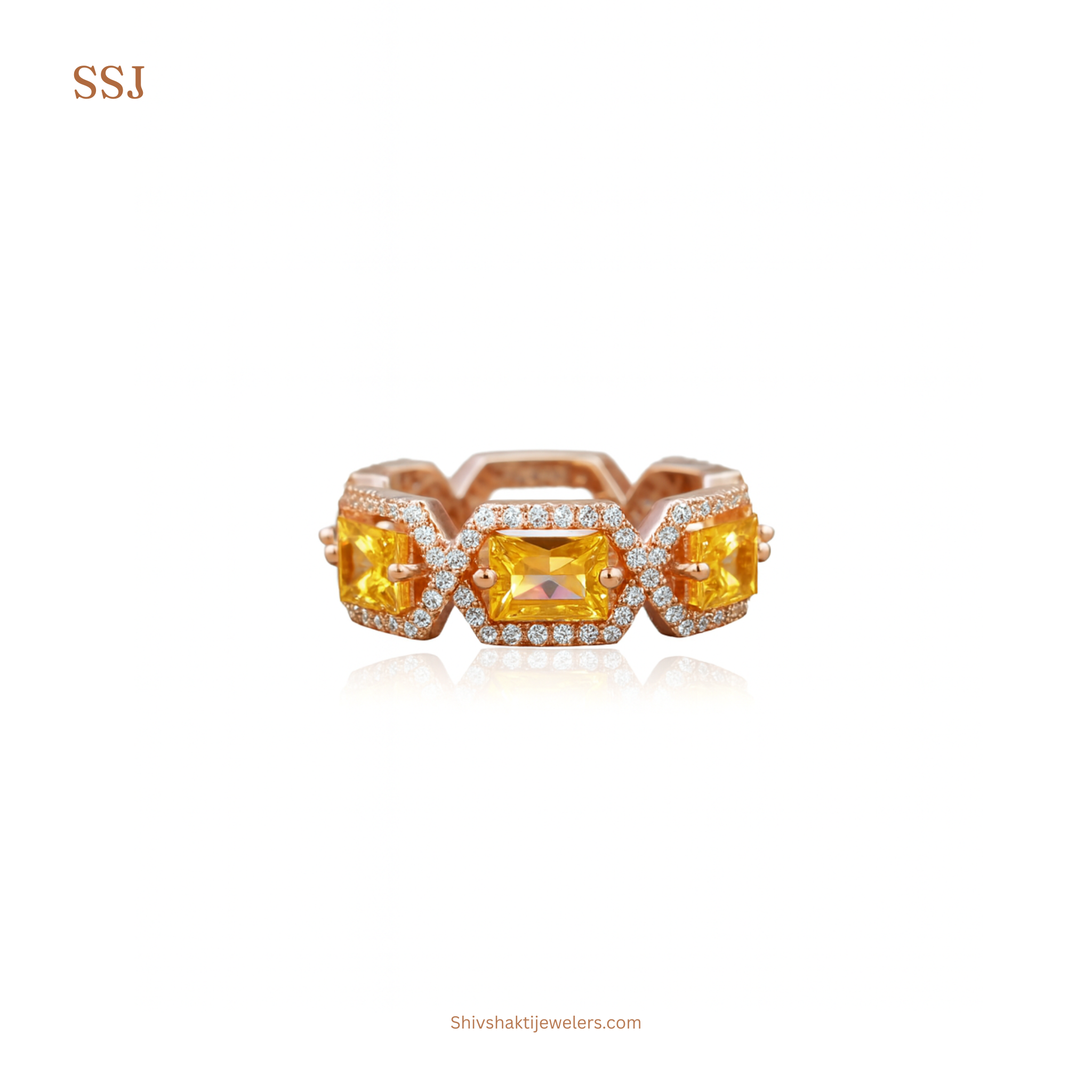 Rose gold ring with yellow gemstones on a white background
