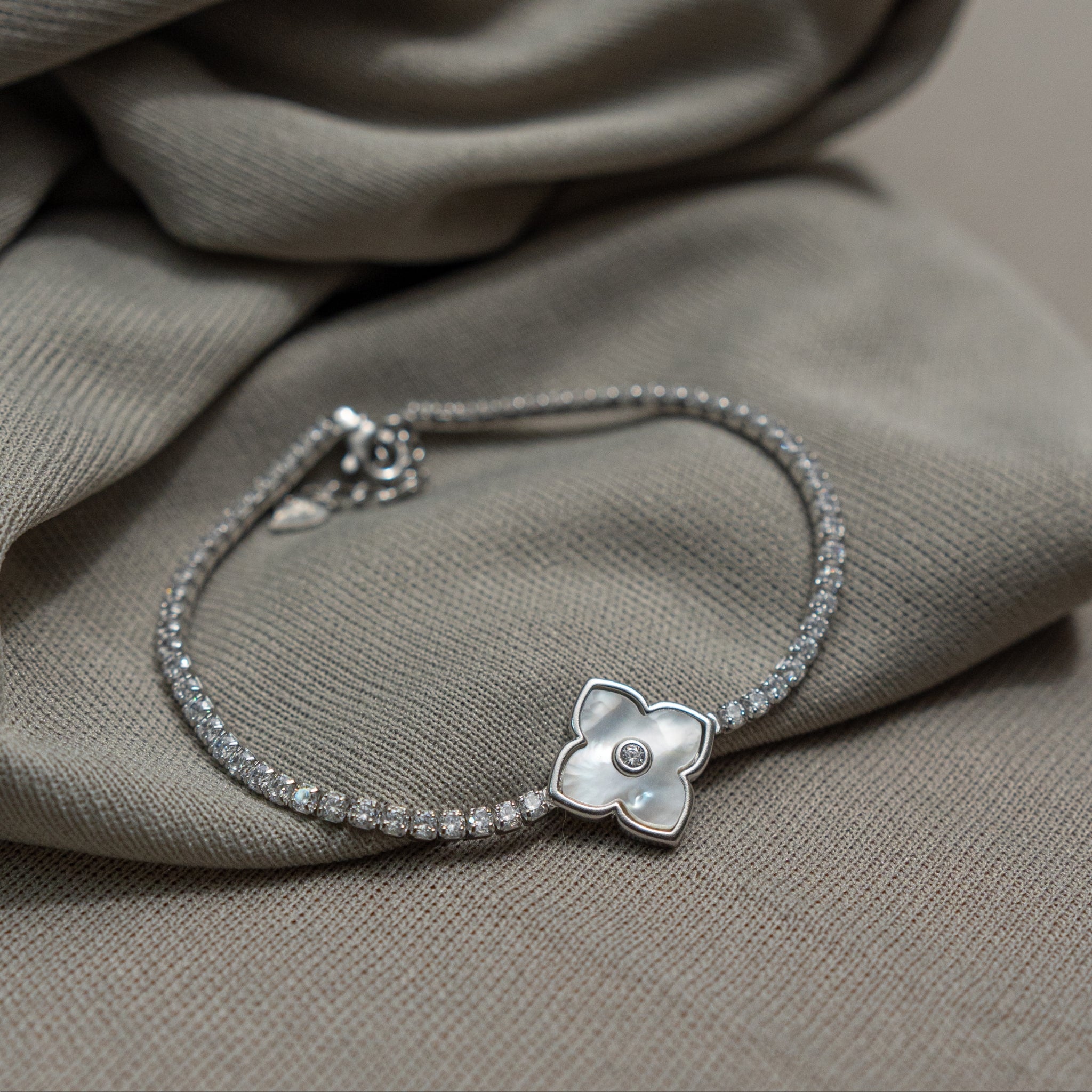925 silver floral CZ bracelet with sparkling chain and flower charm
