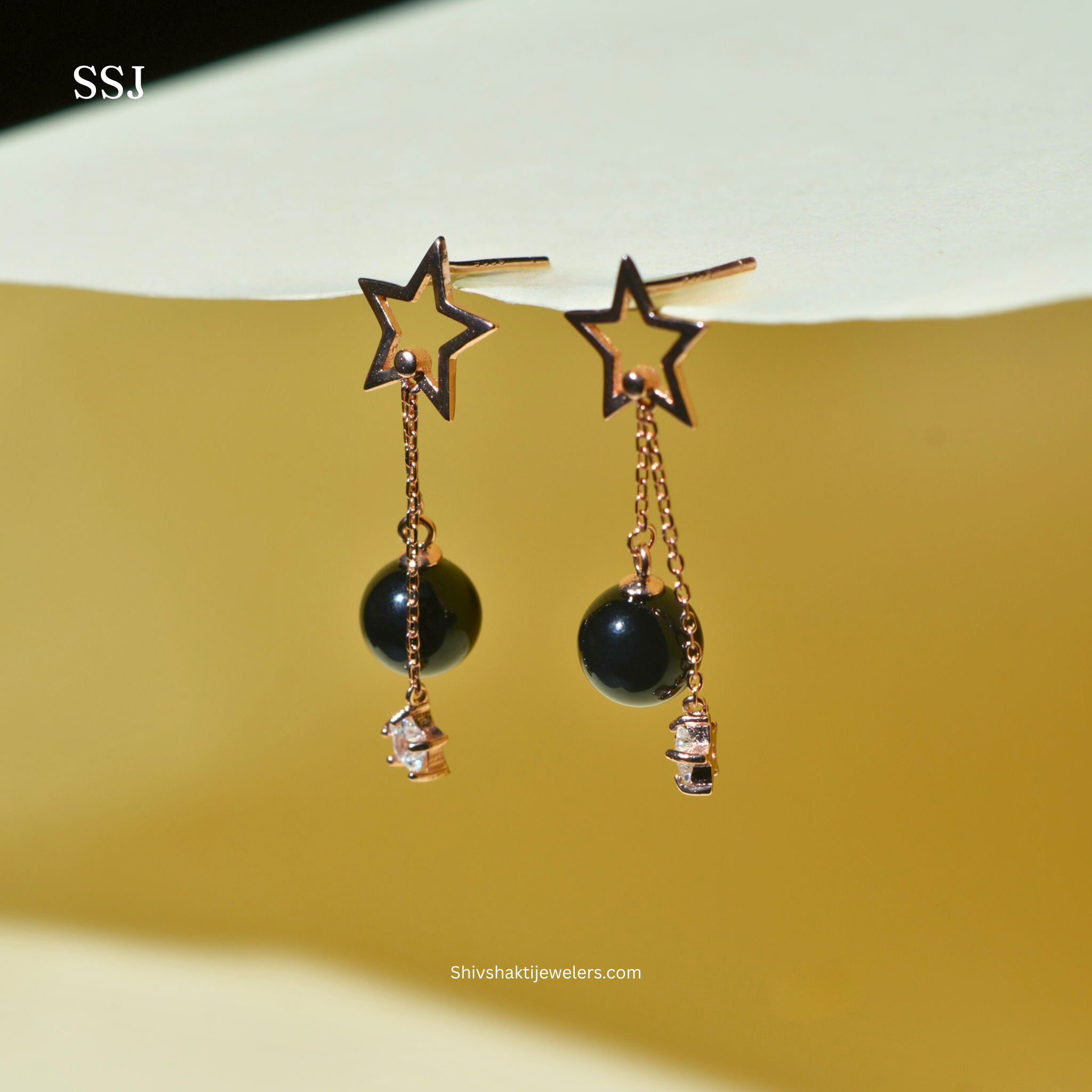 Rose gold plated 925 silver star drop earrings with black bead and crystal charm
