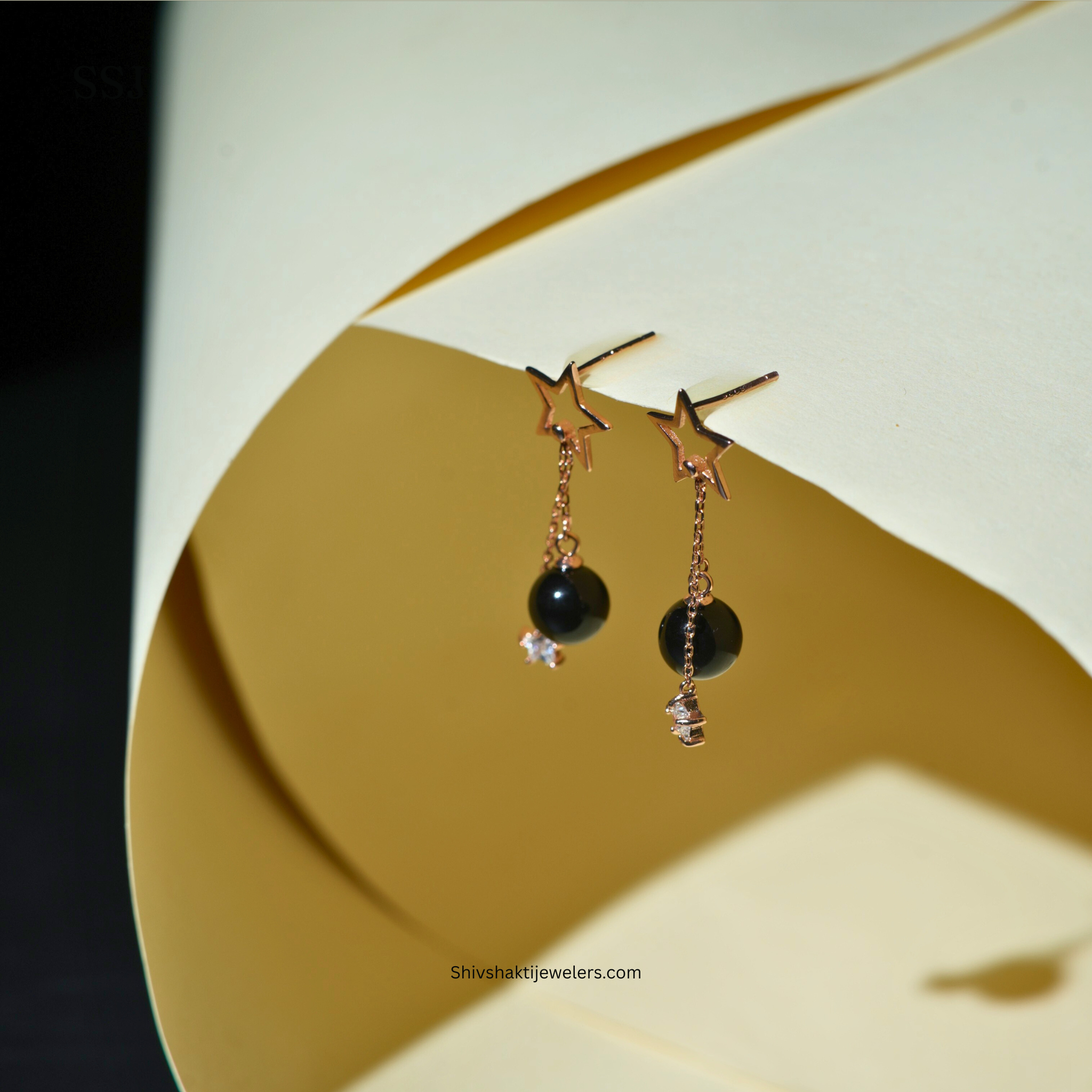 Rose gold plated 925 silver star drop earrings with black bead and crystal charm