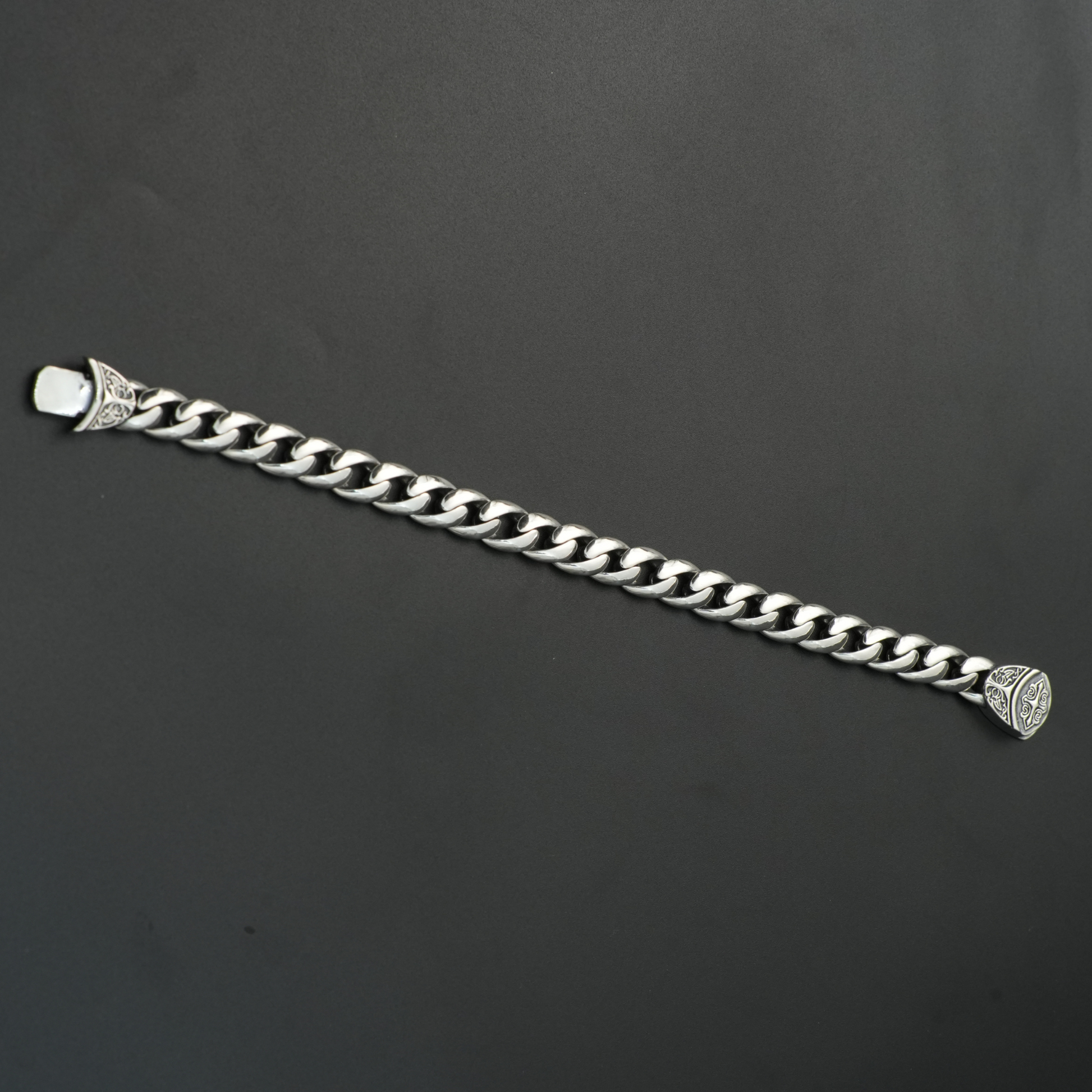 Full view of unisex oxidized silver chain bracelet laid flat