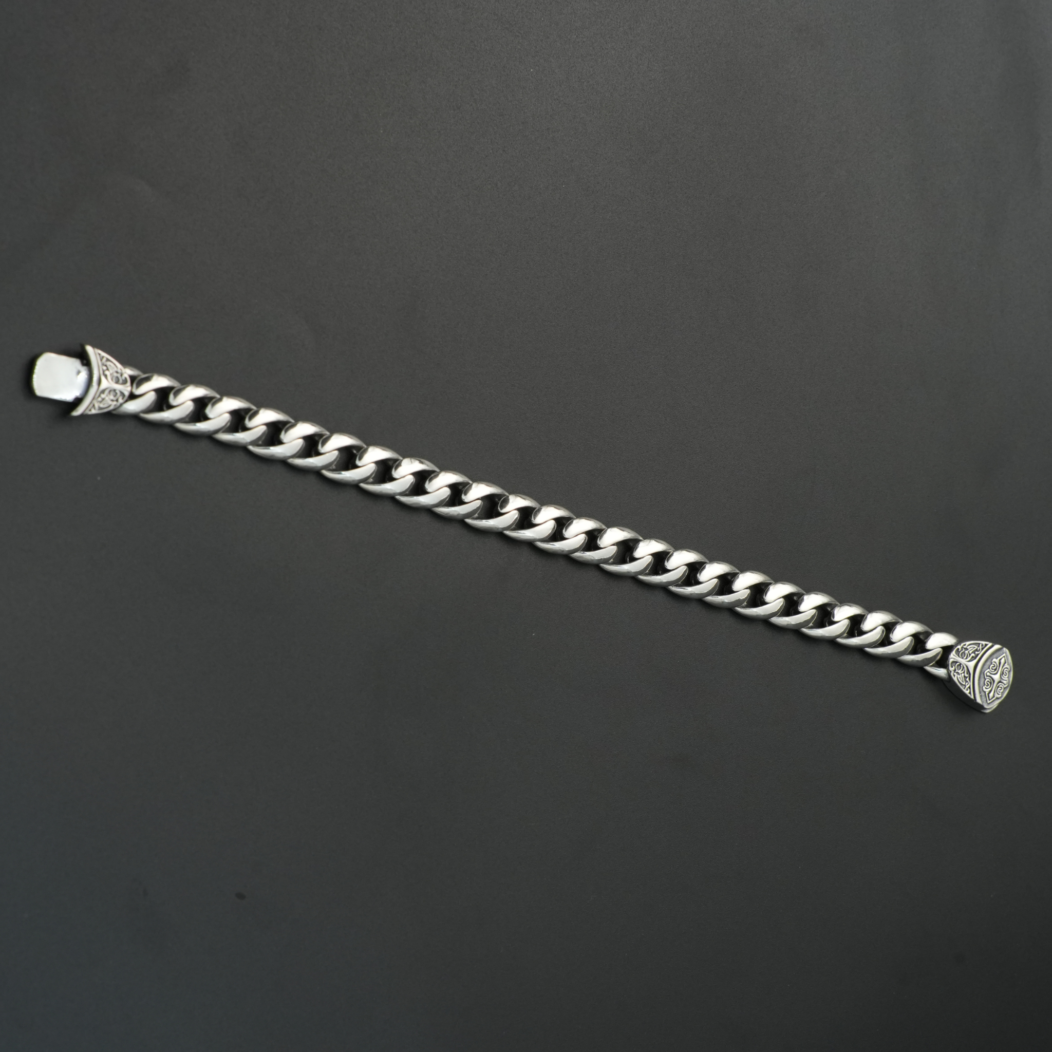 Full view of unisex oxidized silver chain bracelet laid flat