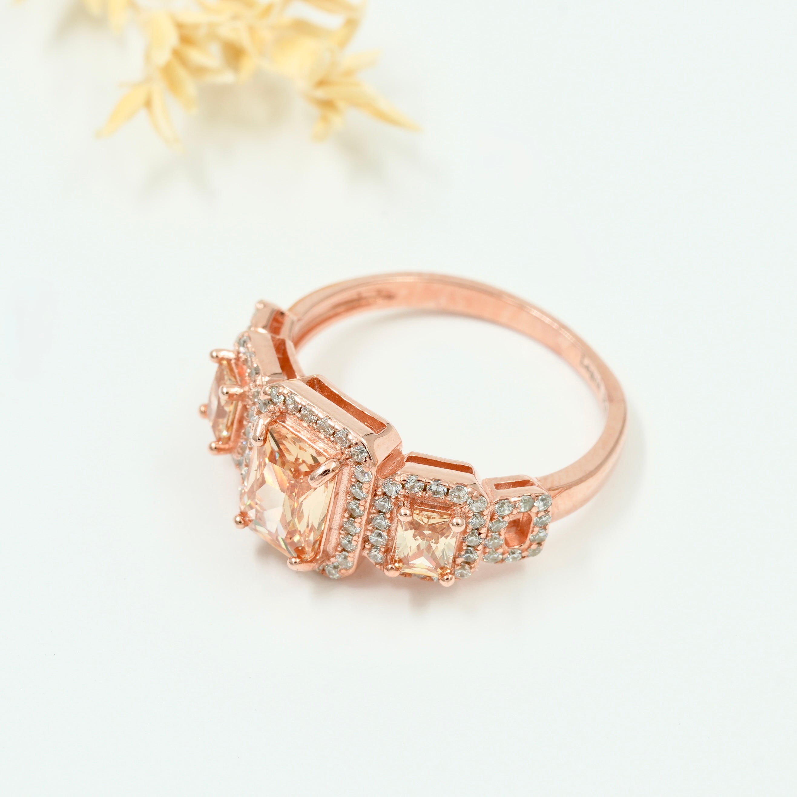 Rose Gold Plated 925 Silver Triple Stone Ring with American Diamond Halo – Available in Blue, Yellow & Peach