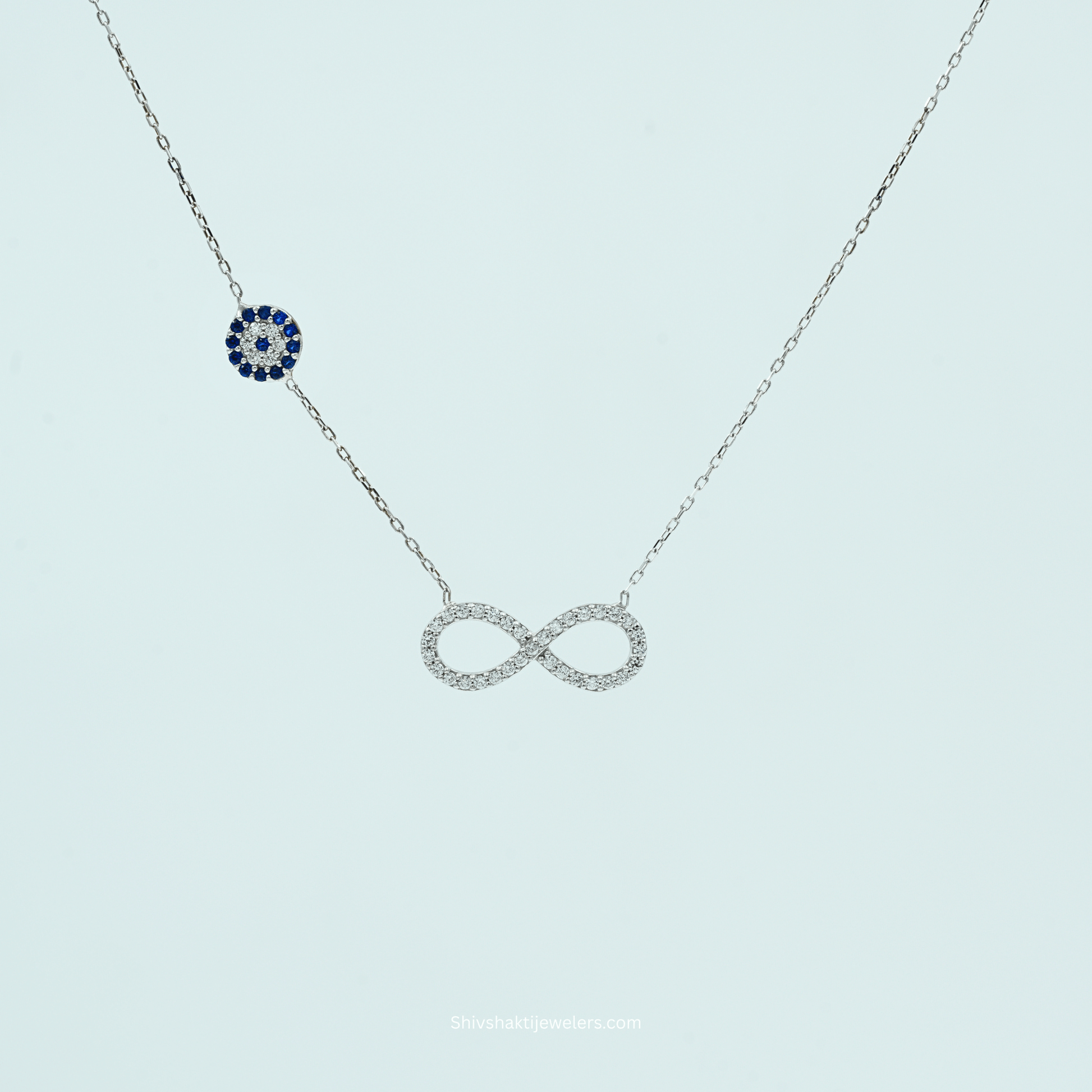 Close-up of 925 Silver Infinity & Evil Eye Pendant Necklace with Blue Evil Eye Charm
