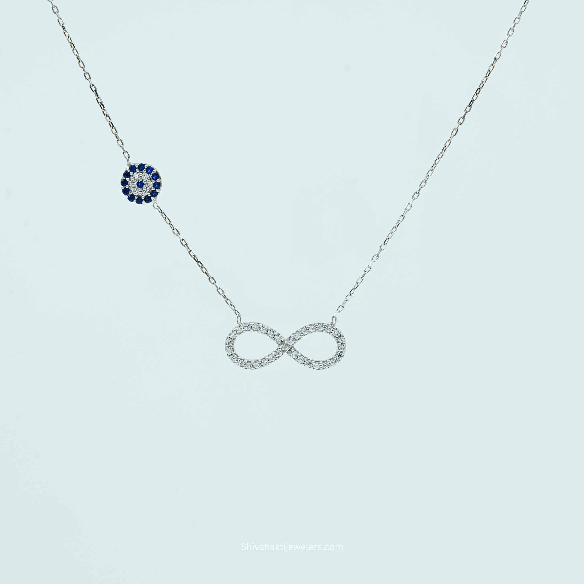 Close-up of 925 Silver Infinity & Evil Eye Pendant Necklace with Blue Evil Eye Charm
